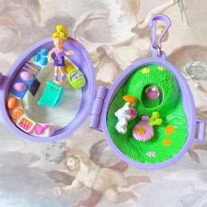 Vintage 2000s Polly Pocket purple easter egg keychain play set. Includes doll.